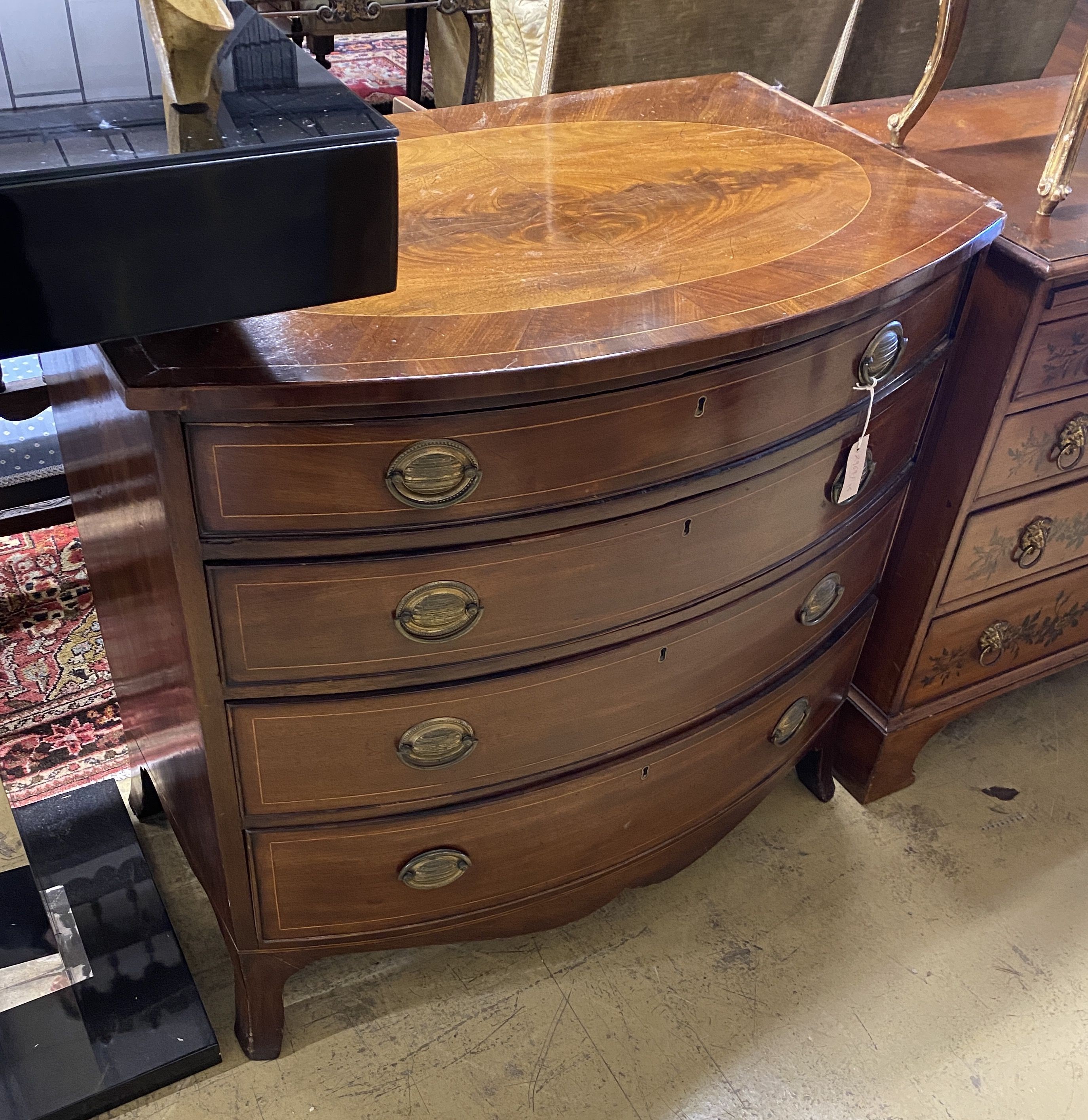 A Regency inlaid mahogany bow front chest of four drawers, width 92cm, depth 57cm, height 91cm